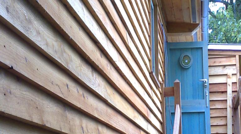 Timber cladding on a cabin style eco house.