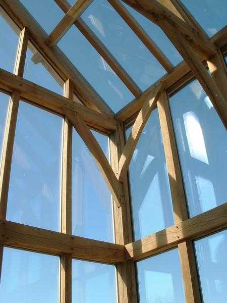 An oak skeleton frame with direct glazed walls and roof.